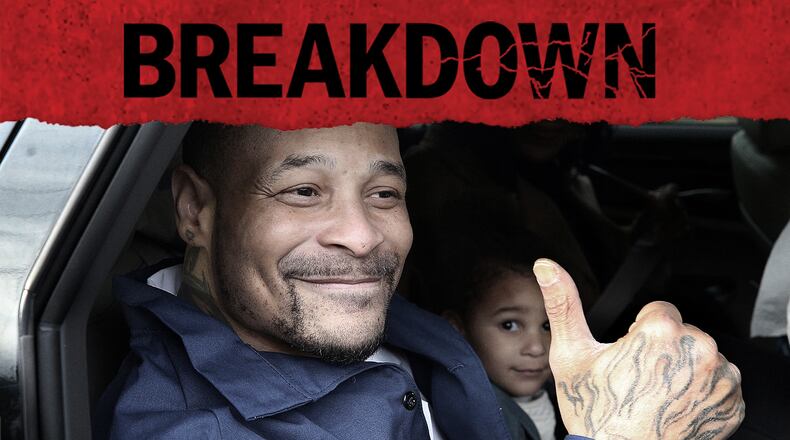 Devonia Inman gives a thumbs-up as he is driven away from Augusta State Medical Prison, after serving 23 years in prison for a wrongful conviction. His case was featured in the fourth season of the AJC's "Breakdown" podcast. (Curtis Compton / curtis.compton@ajc.com)