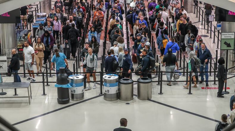 May 25, 2023 Hartsfield-Jackson International Airport: Reports of COVID-19 cases are at a low for the year in Georgia so few are masking as they pass through Hartsfield-Jackson International Airport in advance of the Memorial Day weekend. (John Spink / John.Spink@ajc.com)