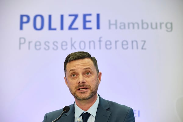 Florian Abbenseth, police press spokesman, speaks at a press conference by the police and Chief Public Prosecutor at police headquarters after a 20-year-old was arrested on suspicion of murdering a child, in Hamburg, Germany, Wednesday, June 18, 2025. (Georg Wendt/dpa via AP)