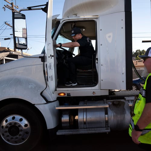 FILE - A student driver gets on a truck as the instructor watches in Calif., Nov. 15, 2021. (AP Photo/Jae C. Hong, File)