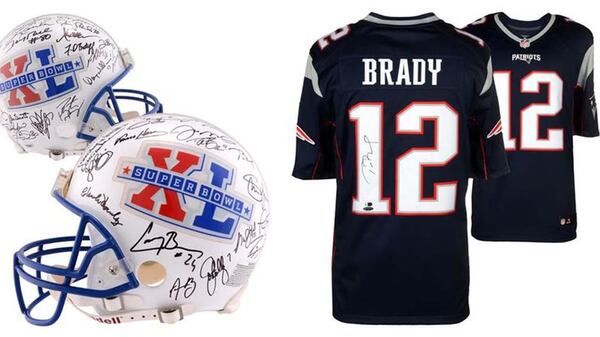A collectible helmet with 43 different autographs and a signed Tom Brady jersey-some of the best NFL swag money can buy. (NFL Shop)