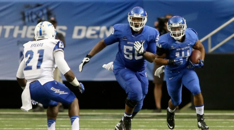 Sep 13, 2014; Atlanta, GA, USA; Georgia State Panthers guard Tim Wynn (50) blocks for Georgia State Panthers running back Duvall Smith (14) as Air Force Falcons defensive back Christian Spears (21) defends during their game at the Georgia Dome. Air Force won 48-38. Mandatory Credit: Jason Getz-USA TODAY Sports