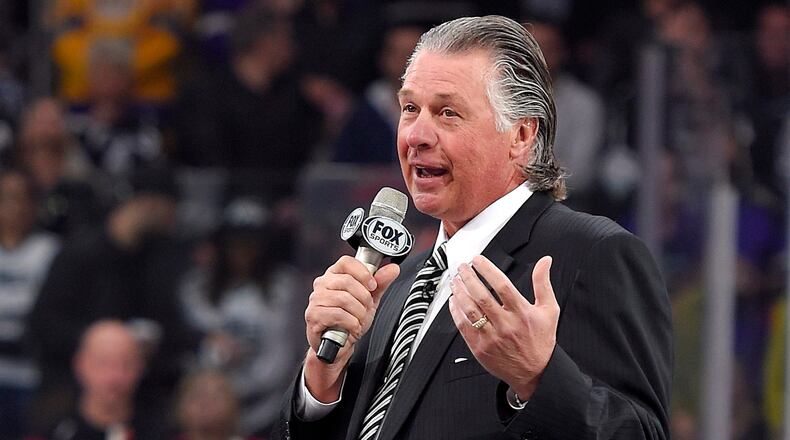 FILE - Former Los Angeles Kings coach Barry Melrose speaks to fans as he is honored prior to an NHL hockey game between the Kings and the Calgary Flames, on Feb. 12, 2015, in Los Angeles. (AP Photo/Mark J. Terrill, File)
