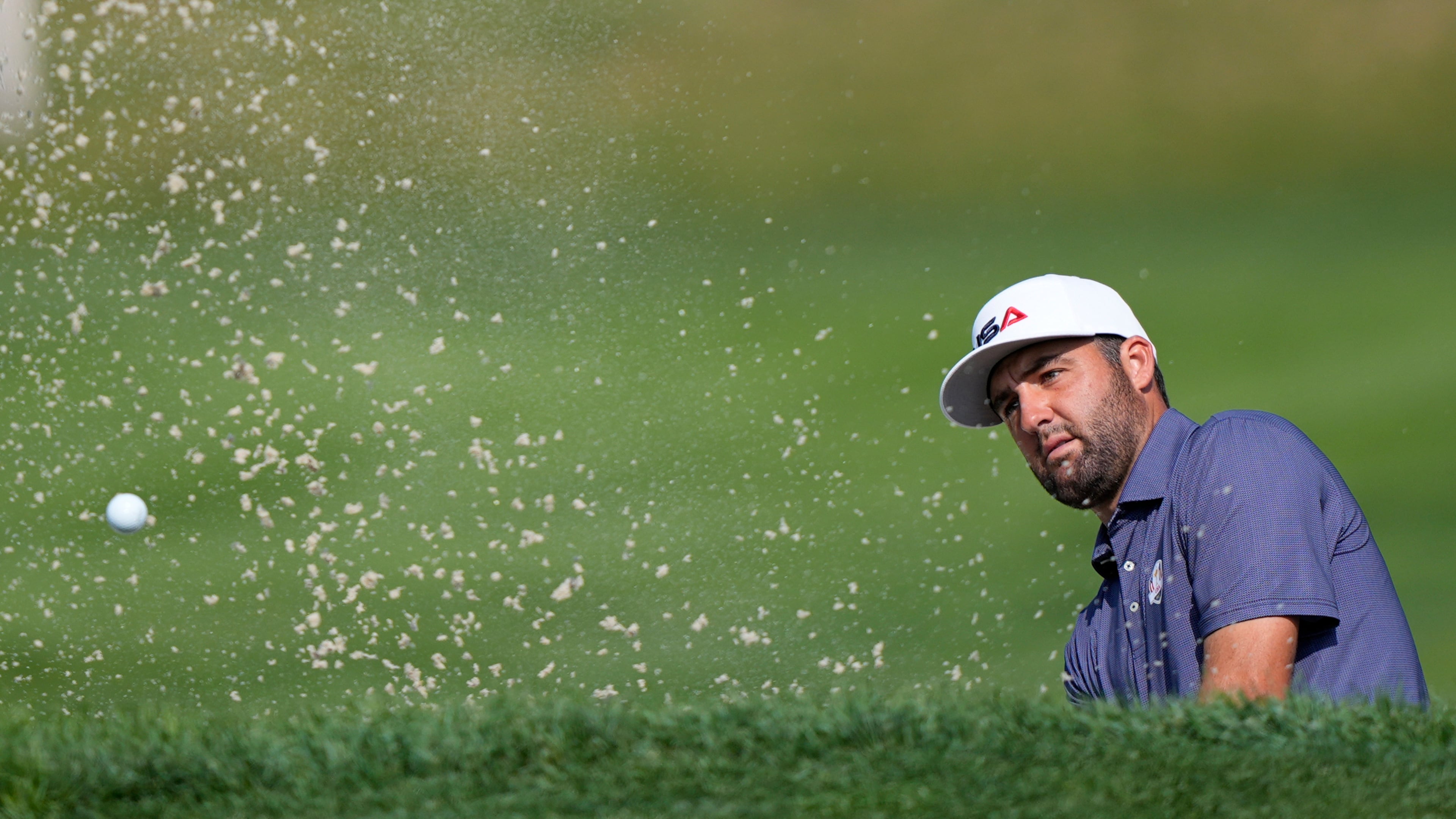 United States' Scottie Scheffler hits from the bunker on the 11th hole during a practice round for the Ryder Cup golf tournament, Tuesday, Sept. 23, 2025, in Farmingdale, N.Y., at Bethpage State Park's Black Course. (AP Photo/Robert Bukaty)