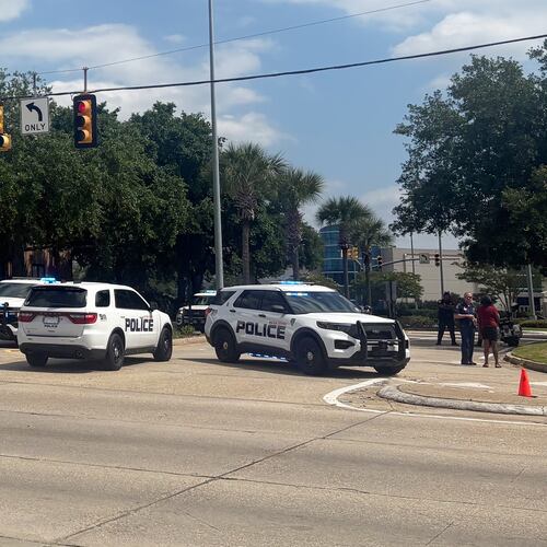 Law enforcement personnel respond to reports of a shooting at Mall of Louisiana in Baton Rouge, La., Thursday, April 23, 2026. (AP Photo/Sara Cline)