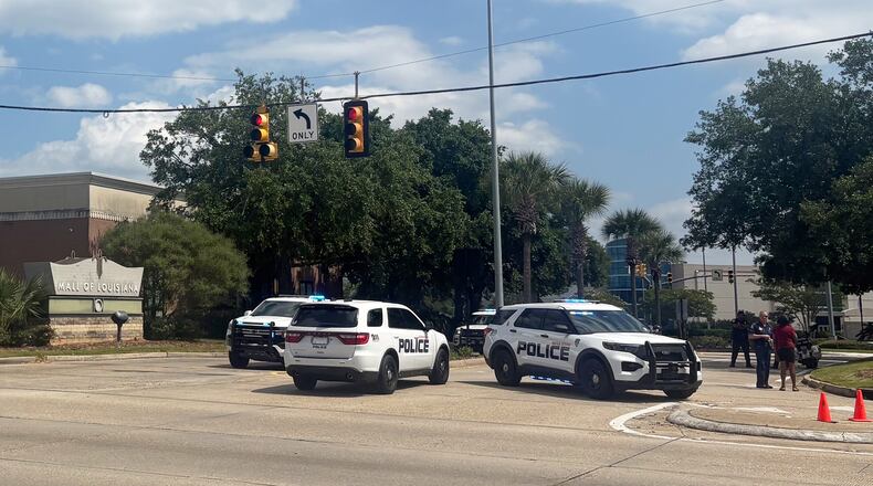 Law enforcement personnel respond to reports of a shooting at Mall of Louisiana in Baton Rouge, La., Thursday, April 23, 2026. (AP Photo/Sara Cline)
