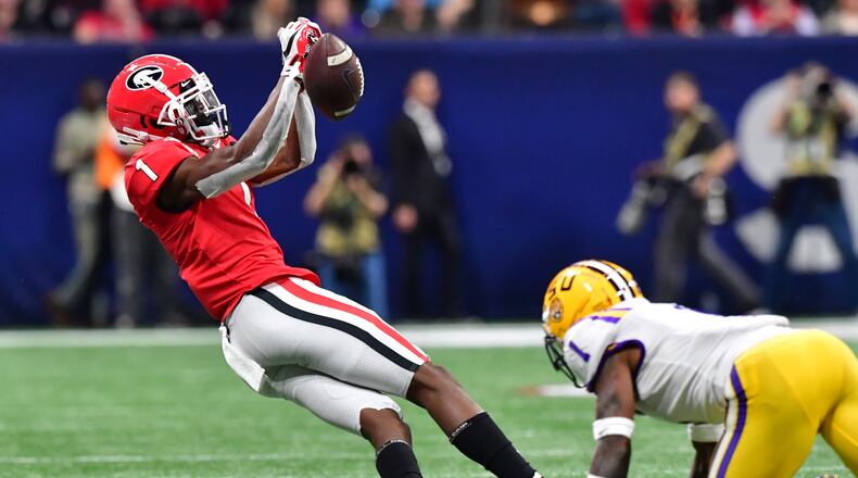 Georgia Bulldogs wide receiver George Pickens (1) is unable to make a catch under pressure from LSU Tigers cornerback Kristian Fulton (1) during the second half of the Georgia vs. LSU SEC Football Championship game at Mercedes-Benz Stadium in Atlanta.  Hyosub Shin / hyosub.shin@ajc.com