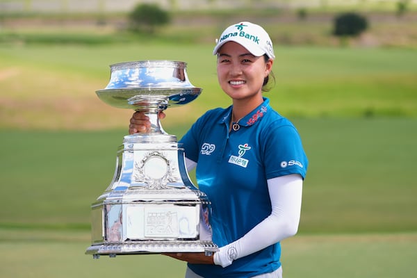 Minjee Lee holds the trophy after winning the Women's PGA Championship golf tournament Sunday, June 22, 2025, in Frisco, Texas. (AP Photo/LM Otero)