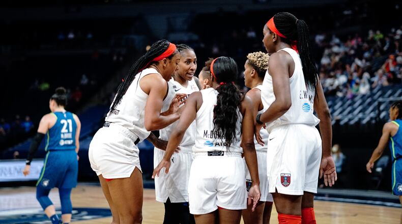 Atlanta Dream players huddle during game against Minnesota Lynx on Sunday, June 6, 2021, in Minnesota. (Kelsey Bibik/Atlanta Dream)