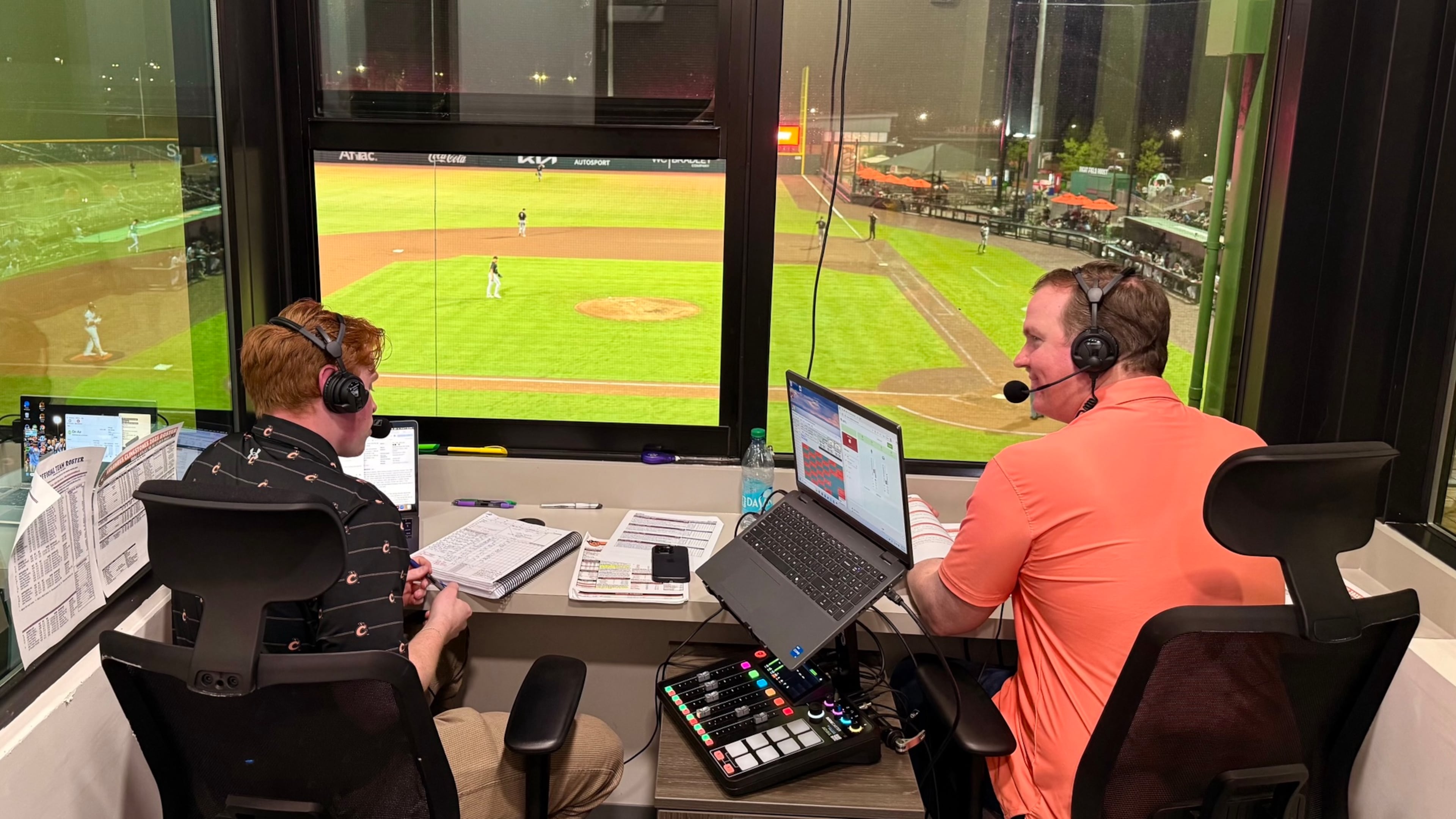 When he’s not navigating the halls of Congress, U.S. Rep. Brian Jack (right) joins Columbus Clingstones play-by-play host Jack Johnson. (Greg Bluestein/AJC)