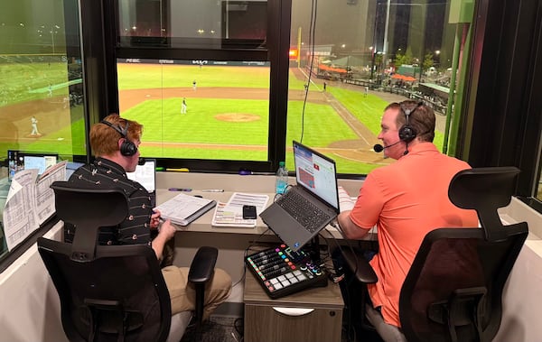 U.S. Rep. Brian Jack delivers color commentary at a Columbus Clingstones game in 2025. (AJC/Greg Bluestein)