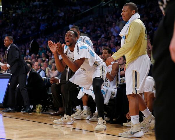 Georgia Tech forward Charles Mitchell applauds on the bench during the second half of the team's NCAA college basketball game against Notre Dame in Atlanta, Saturday, Feb. 20, 2016. Georgia Tech won the game 63-62. (AP Photo/Todd Kirkland)