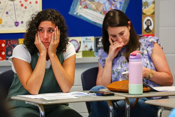 Parents listen to a DeKalb County School District presentation at Dunwoody High School in March. (Colin Hubbard/AJC 2026)