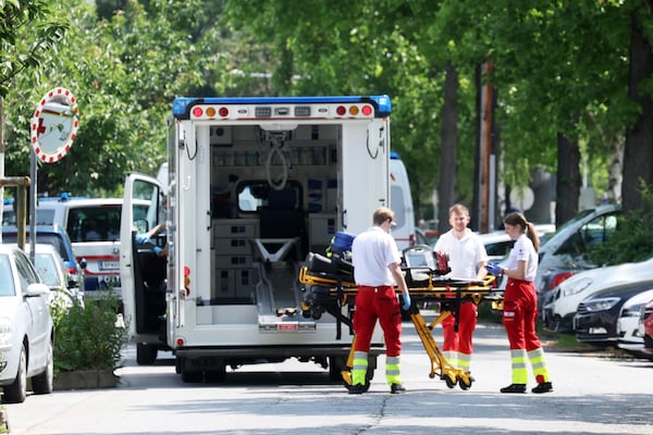Rescue service personnel attend the scene of a shooting at a school in Graz, Austria, Tuesday, June 10, 2025. (Kleine Zeitung via AP)