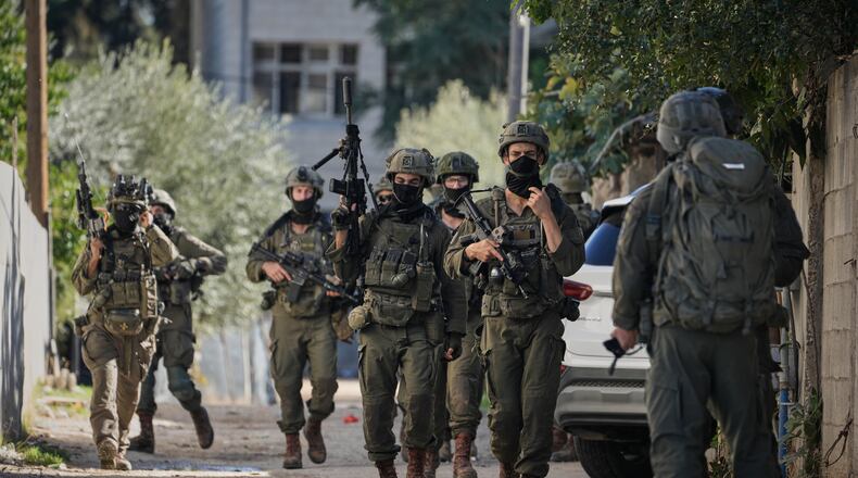 Israeli soldiers are seen during an army raid in the West Bank town of Tubas, Wednesday, Nov. 26, 2025. (AP Photo/Majdi Mohammed)