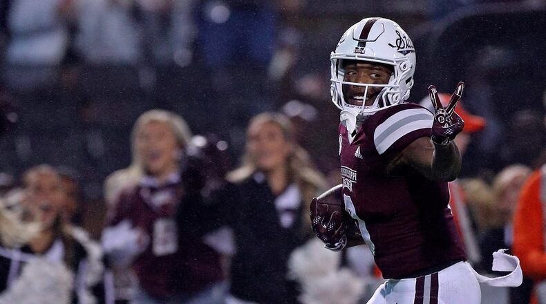 Rara Thomas of the Mississippi State Bulldogs gestures as he carries the ball during the second half against the Auburn Tigers at Davis Wade Stadium on Nov. 5, 2022, in Starkville, Miss. Thomas was arrested Monday on charges of false imprisonment and battery/family violence. (Justin Ford/Getty Images/TNS)