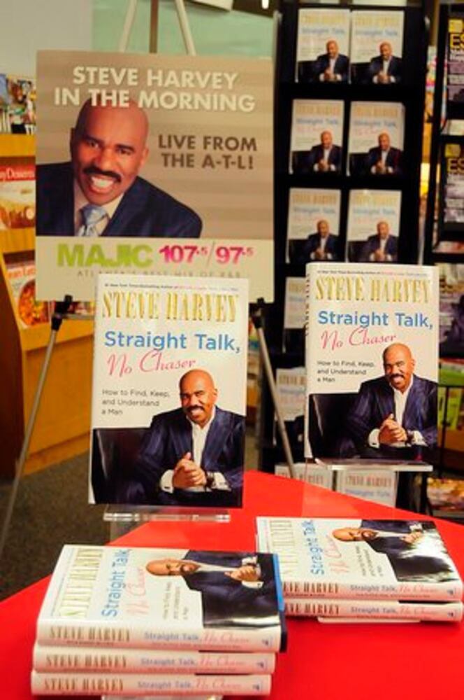 Steve Harvey signs his book 'Straight Talk, No Chaser'