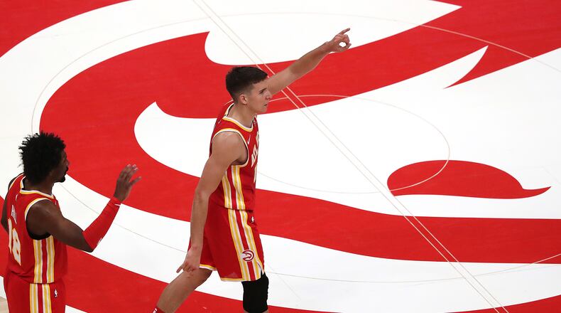122820 ATLANTA: Atlanta Hawks Bogdan Bogdanovic reacts to hitting a three against the Detroit Pistons in a NBA basketball game on Monday, Dec. 28, 2020, in Atlanta. “Curtis Compton / Curtis.Compton@ajc.com”