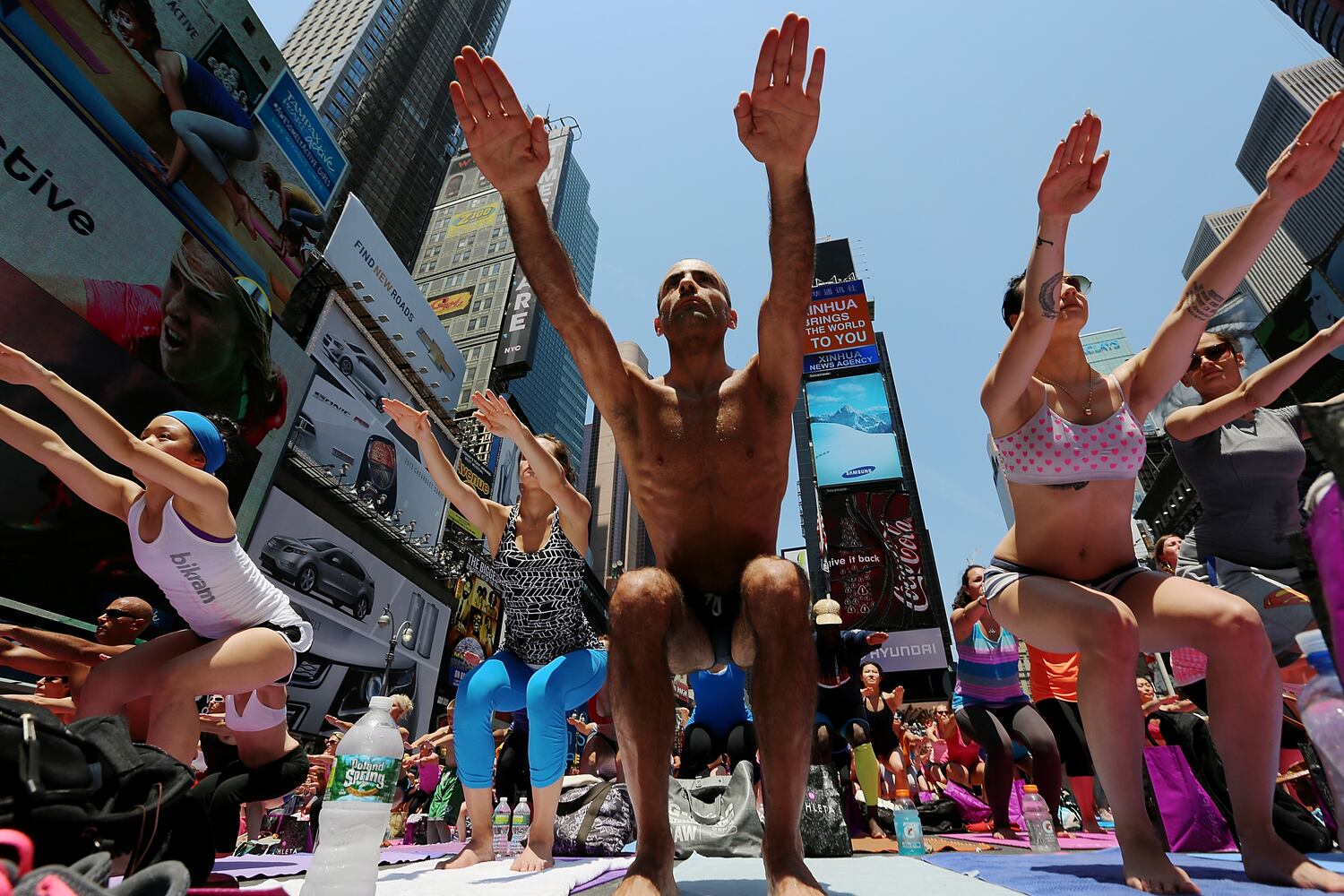 Enthusiasts perform yoga in Times Square to mark summer solstice, June 21, 2013