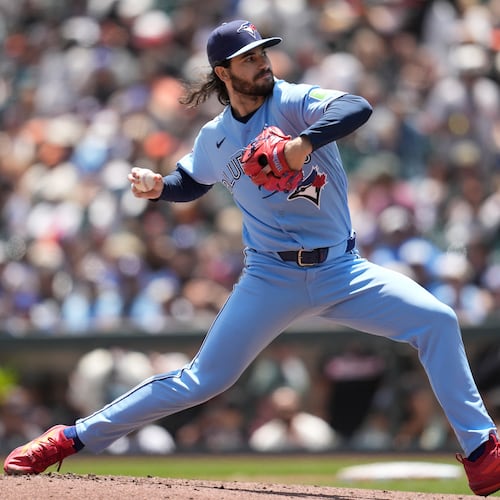 Toronto Blue Jays pitcher Dylan Cease throws against the San Francisco Giants during the first inning of a baseball game Wednesday, July 8, 2026, in San Francisco. (AP Photo/Jeff Chiu)