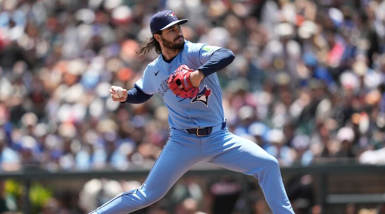 Toronto Blue Jays pitcher Dylan Cease throws against the San Francisco Giants during the first inning of a baseball game Wednesday, July 8, 2026, in San Francisco. (AP Photo/Jeff Chiu)