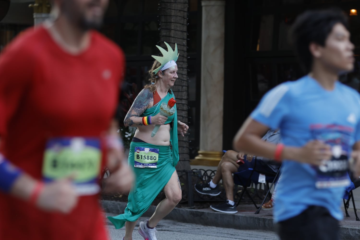 A costumed runner participates in the 56th AJC Peachtree Road Race on Friday, July 4, 2025, in Atlanta. (Natrice Miller/AJC)