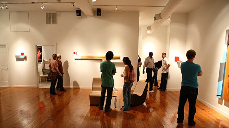 People gathering at one of the galleries to partake in the monthly Castleberry Hill Art Stroll