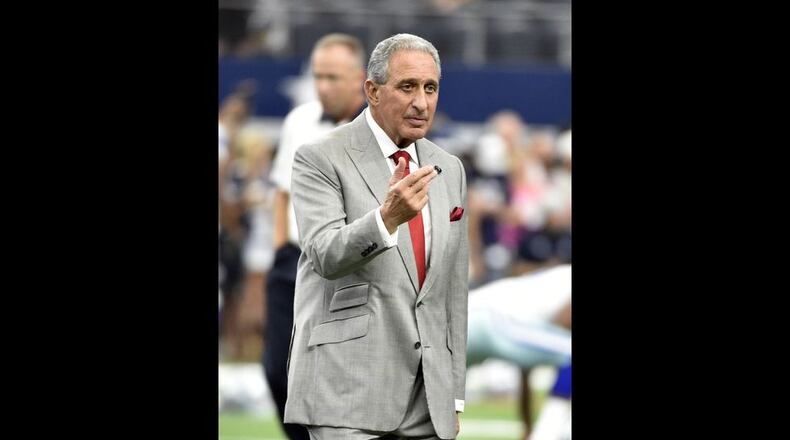 Atlanta Falcons team owner Arthur Blank walks across the field as he talks with others during team warm ups before an NFL football game against the Dallas Cowboys on Sunday, Sept. 27, 2015, in Arlington, Texas. (AP Photo/Michael Ainsworth )