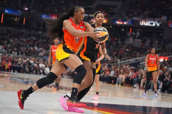 Golden State Valkyries' Kayla Thornton, left, goes to the basket against Chicago Sky's Angel Reese during the first half of a WNBA All-Star basketball game, Saturday, July 19, 2025, in Indianapolis. (AP Photo/Michael Conroy)