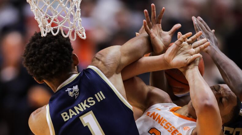 Tech’s James Banks III and Grant Williams of Tennessee fight for a loose ball during their matchup Nov. 13, 2018, at Thompson-Boling Arena in Knoxville, Tenn. Tennessee won the game 66-53.