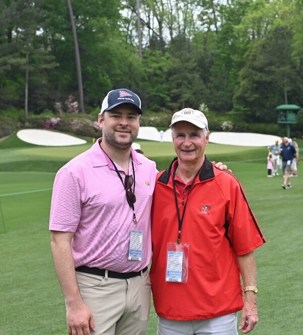 AJC restaurant critic Henri Hollis (left) and his father-in-law, Ralph Leslie, attend a Masters practice round in 2023. (Henri Hollis/AJC)