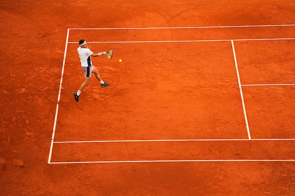 Norway's Casper Ruud returns to Britain's Jack Draper during the Madrid Open tennis final in Madrid, Spain, Sunday, May 4, 2025. (AP Photo/Manu Fernandez)