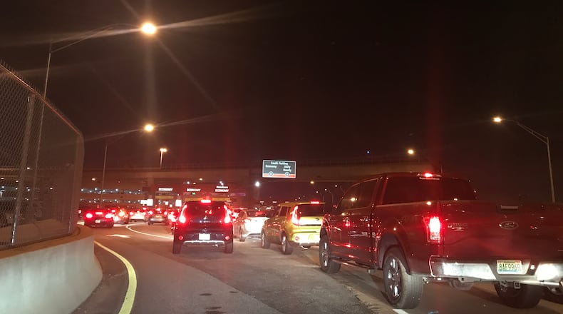 The line of Uber and Lyft drivers at 11:36 p.m. Thursday waiting to enter Hartsfield-Jackson’s economy lot to pick up passengers. Credit: Kelly Yamanouchi