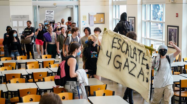 Protesters at Emory marched into Cox Hall near the quad during demonstrations Friday.