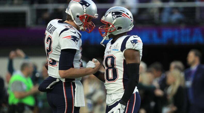 MINNEAPOLIS, MN - FEBRUARY 04: Tom Brady #12 and James White #28 of the New England Patriots shake hands prior to the game against the Philadelphia Eagles in Super Bowl LII at U.S. Bank Stadium on February 4, 2018 in Minneapolis, Minnesota.  (Photo by Mike Ehrmann/Getty Images)