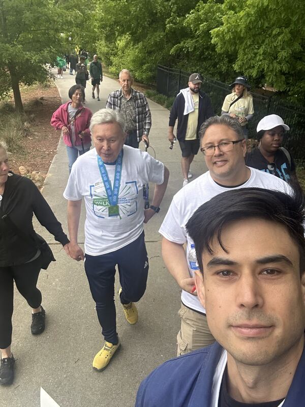 Paul Tom, center, with walking team at the APDA Georgia Optimism Walk 2024. From left, Lorie Coats, Paul Tom, James Tom, and Colin Tom. (Photo by Colin Tom)