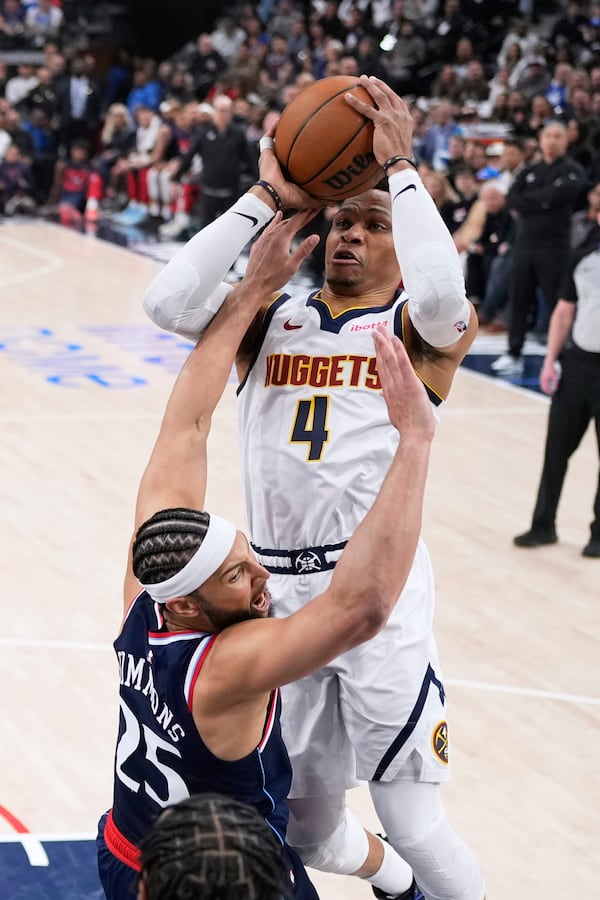 Denver Nuggets guard Russell Westbrook, top, shoots as Los Angeles Clippers guard Ben Simmons (25) defends during the first half in Game 3 of an NBA basketball first-round playoff series Thursday, April 24, 2025, in Inglewood, Calif. (AP Photo/Mark J. Terrill)
