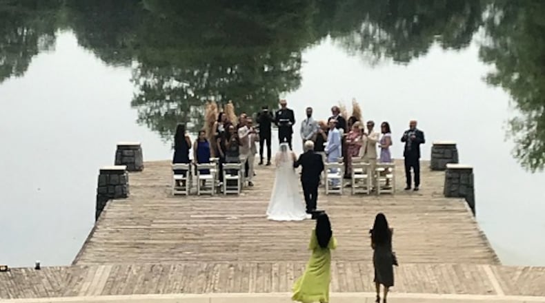 Nancy Hallman and Chris Partido did not have a wedding planned during the pandemic, but did not want to go through what hundreds of other couples have gone through and might continue to do with a possible 2nd wave of COVID-19. Eloping was the next best thing. The couple chose to have their ceremony at Piedmont Park’s historic Lake Clara Meer with family and close friends last weekend. Photo contributed.