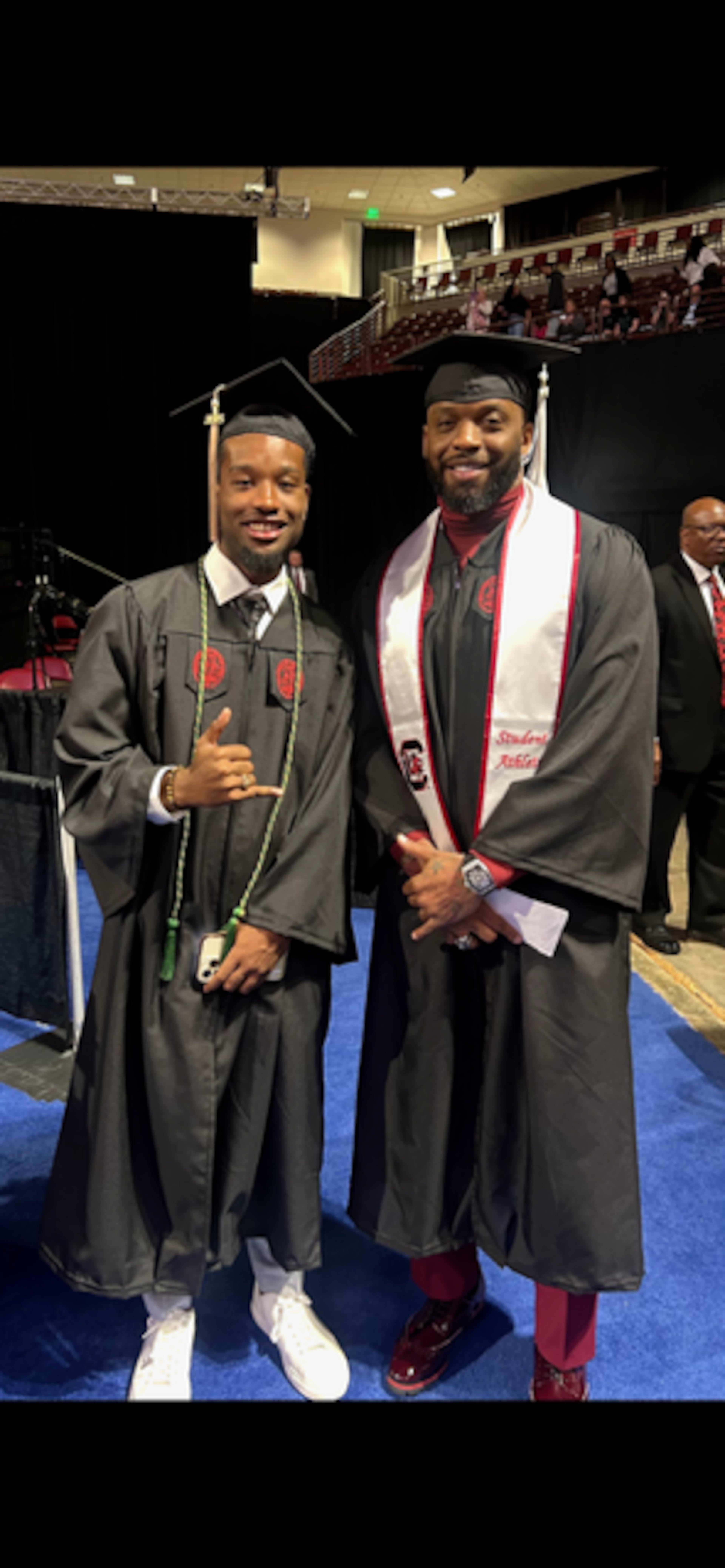 Some of the younger undergrads took photos with John Abraham during his graduation from the University of South Carolina.
