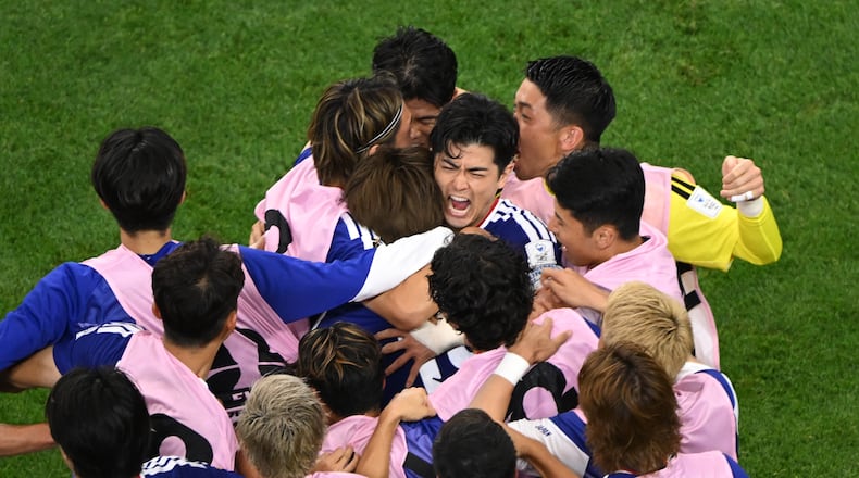 Japan celebrates a goal during the World Cup Group F soccer match between the Netherlands and Japan in Arlington, Texas, near Dallas, Sunday, June 14, 2026. (AP Photo/Jessica Tobias)