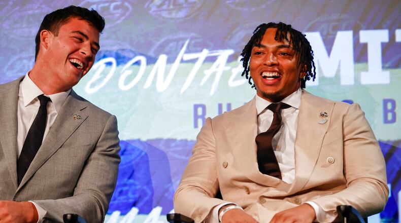 Georgia Tech running back Dontae Smith, right, and tight end Dylan Leonard laugh as the sit on stage at the NCAA college football Atlantic Coast Conference Media Days in Charlotte, N.C., Thursday, July 21, 2022. (AP Photo/Nell Redmond)
