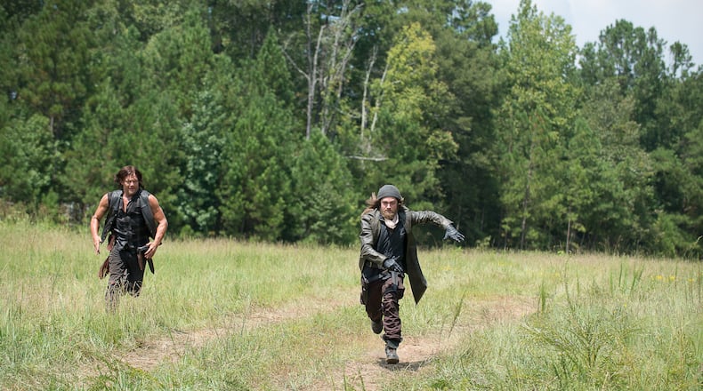 Norman Reedus as Daryl Dixon and Tom Payne as Paul "Jesus" Monroe - The Walking Dead _ Season 6, Episode 10 - Photo Credit: Gene Page/AMC