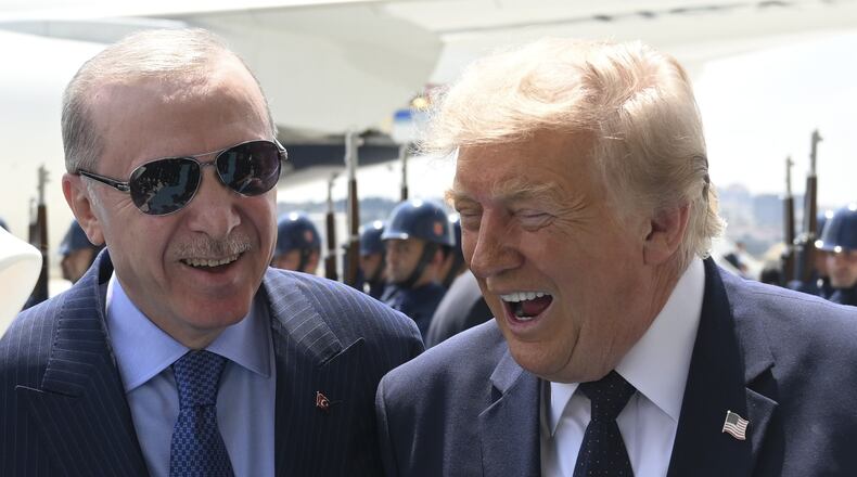 President Donald Trump, right, speaks with Turkish President Recep Tayyip Erdogan as he arrives for the NATO summit in Ankara, Turkey, Tuesday, July 7, 2026. (Doğukan Keskinkılıç, Pool Photo via AP)