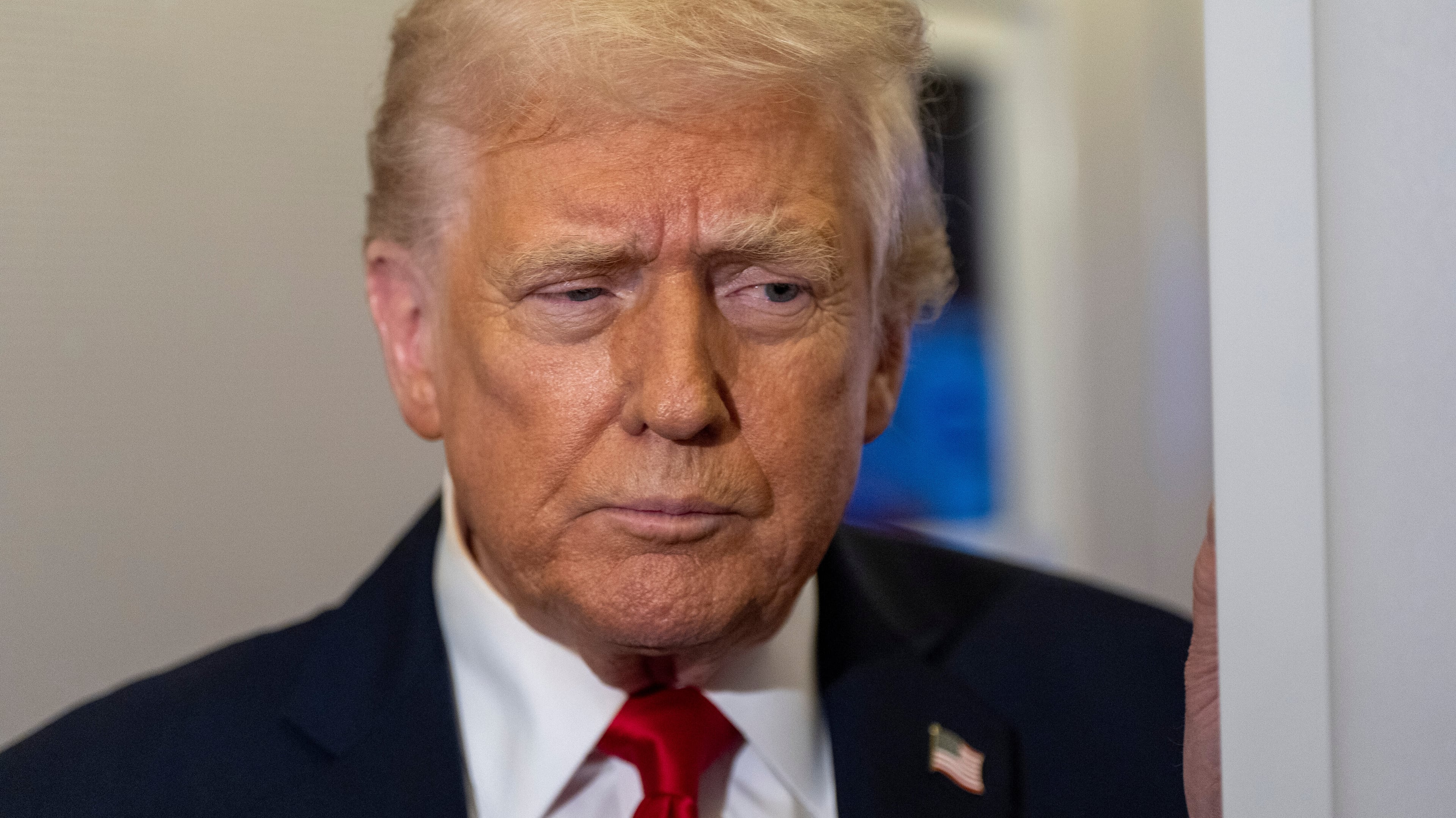 President Donald Trump speaks with reporters while in flight on Air Force One from Joint Base Andrews to his Mar-a-Lago estate in Palm Beach, Fla., Tuesday, Nov. 25, 2025. (AP Photo/Alex Brandon)