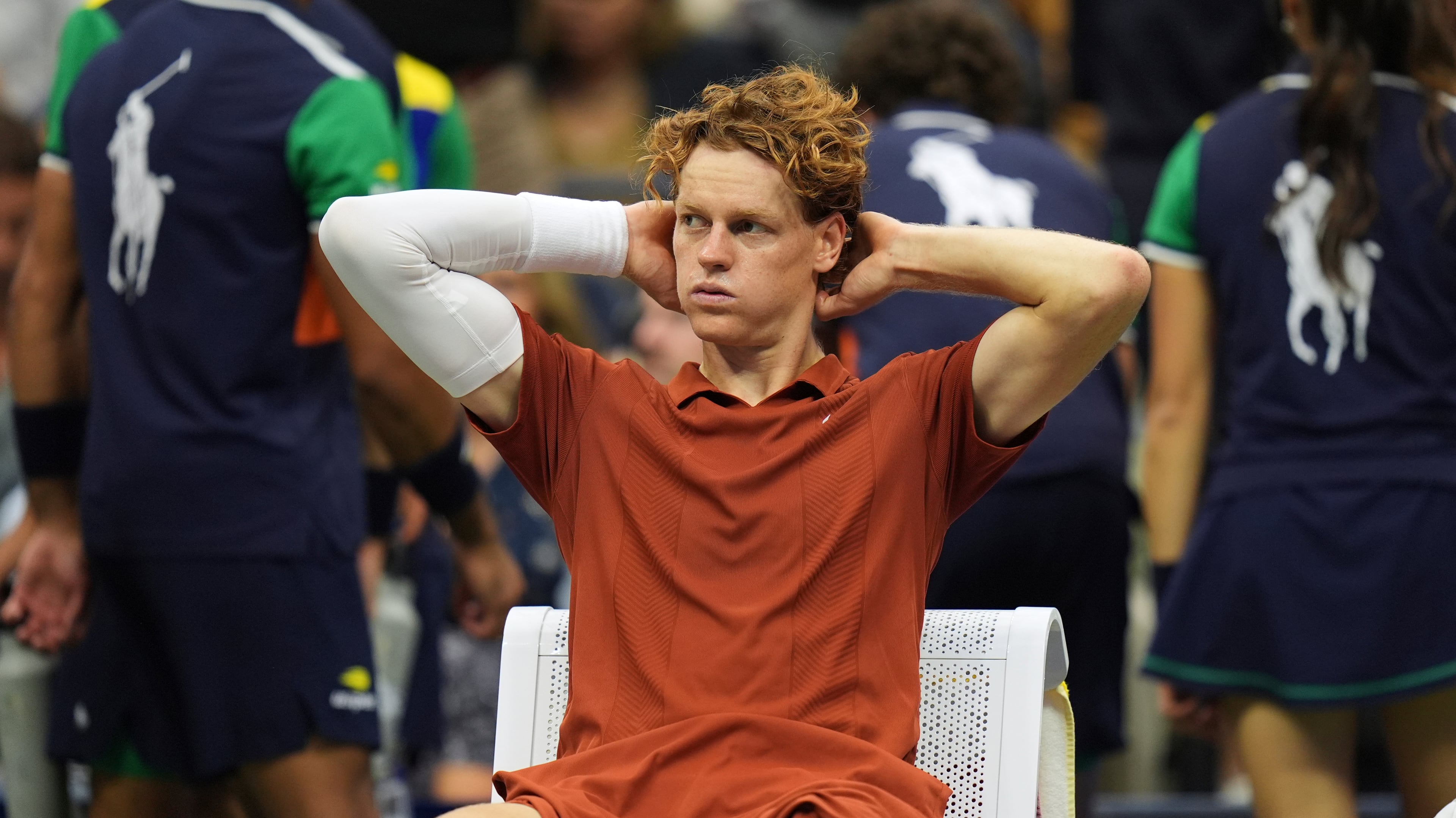 Jannik Sinner, of Italy, sits between sets during the men's singles final of the U.S. Open tennis championships against Carlos Alcaraz, of Spain, Sunday, Sept. 7, 2025, in New York. (AP Photo/Seth Wenig)