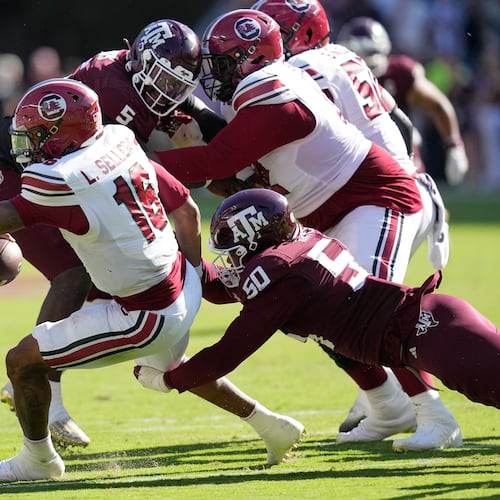 South Carolina quarterback Lanorris Sellers (16) is sacked by Texas A&M defensive end Dayon Hayes (50) during the second half of an NCAA college football game Saturday, Nov. 15, 2025, in College Station, Texas. (AP Photo/David J. Phillip)