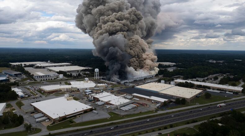 FILE - Smoke billows from a fire at the BioLab facility in Conyers, Ga., Sunday, Sept. 29, 2024. (Ben Gray/Atlanta Journal-Constitution via AP, file)