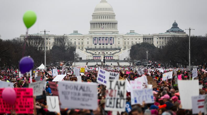 Protesters gather on the National Mall for the Women's March on Washington during the first full day of Donald Trump's presidency, Saturday, Jan. 21, 2017 in Washington. (AP Photo/John Minchillo)
