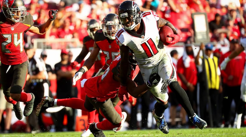 Wide receiver Julio Jones  of the Atlanta Falcons picks up a first down in the fourth quarter of the game at Raymond James Stadium on December 30, 2018 in Tampa, Florida. (Photo by Will Vragovic/Getty Images)
