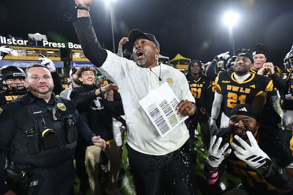 Kennesaw State head coach Jerry Mack and players celebrate after an October win over UTEP.